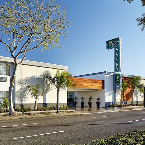 The image features the exterior of a building with a sign identifying it as a 